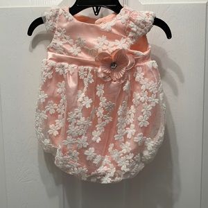 Perfect newborn outfit. Floral design. Large flower around waist.
